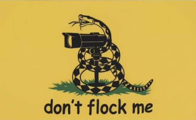 A Gadsden-flag parody on a yellow field: a coiled rattlesnake wraps around a surveillance camera on a tripod instead of striking, above the caption 'don't flock me,' a play on Flock Safety's surveillance cameras.